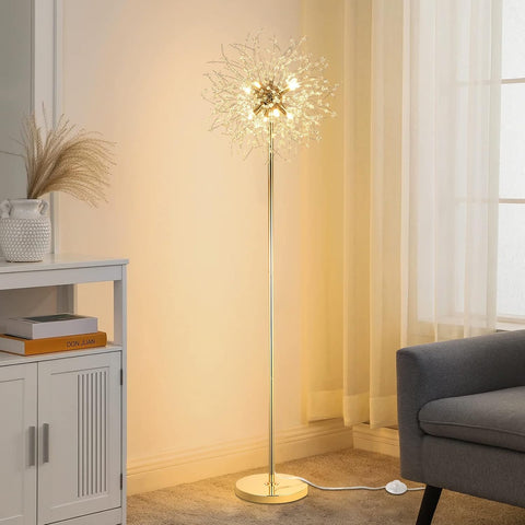 Decorative floor lamp in a living room setting with a gray sofa and white cabinet.