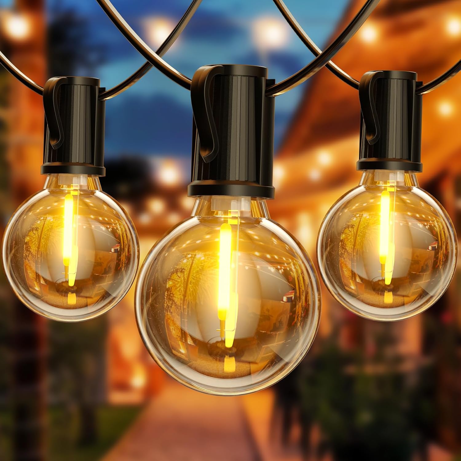 String lights with glowing bulbs against a blurred outdoor background