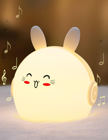 Cute rabbit-shaped night light with musical notes on a soft background