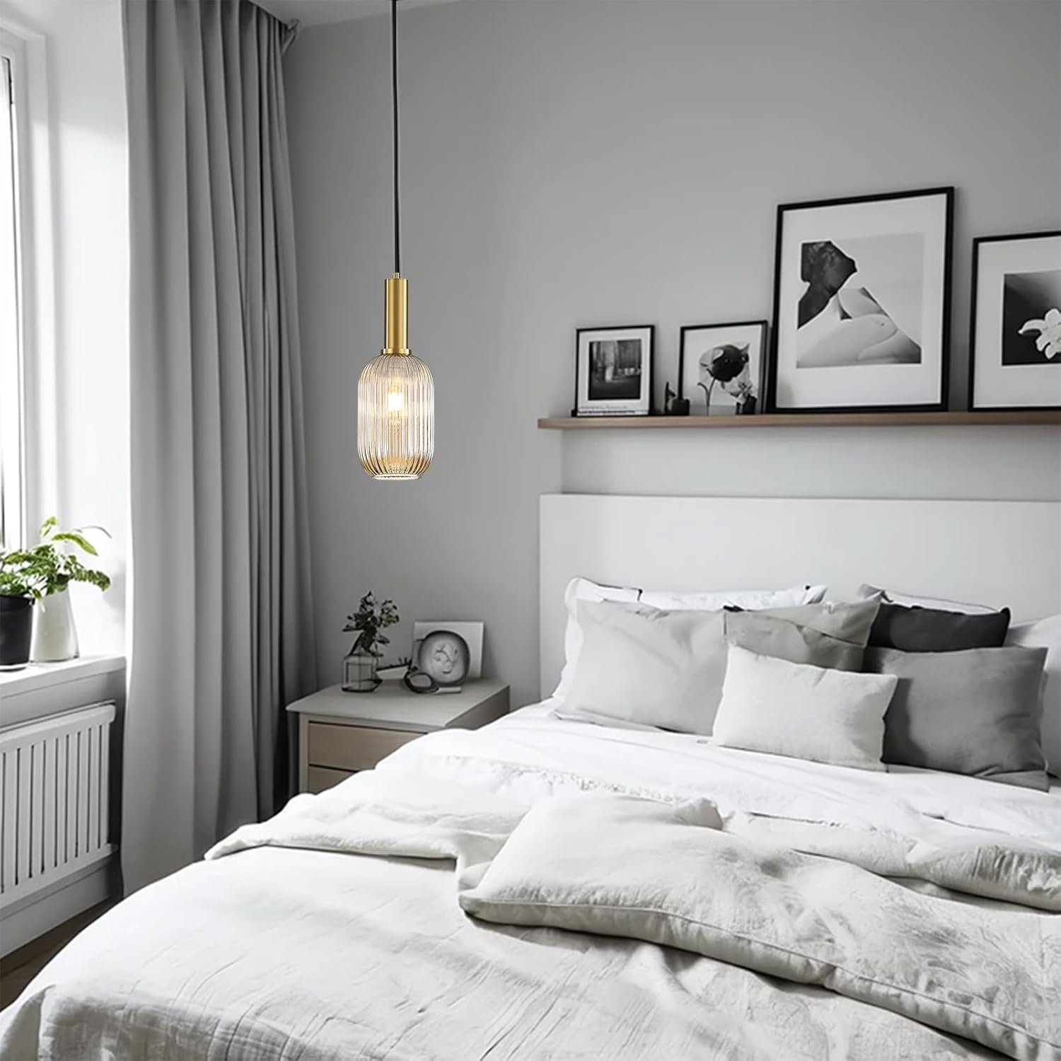 Modern bedroom with a bed, nightstand, and wall art.
