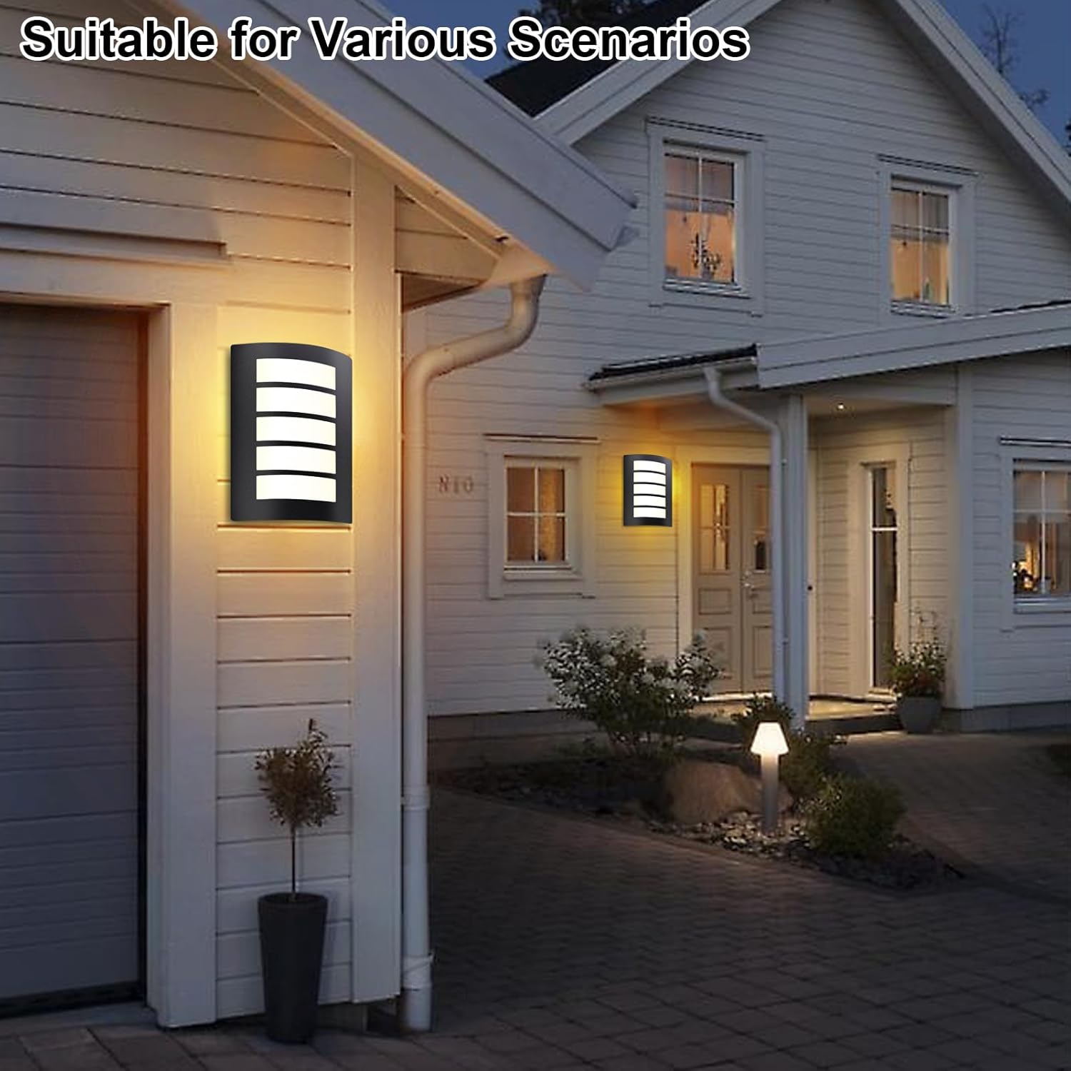 House exterior with outdoor wall lights and a well-lit pathway.