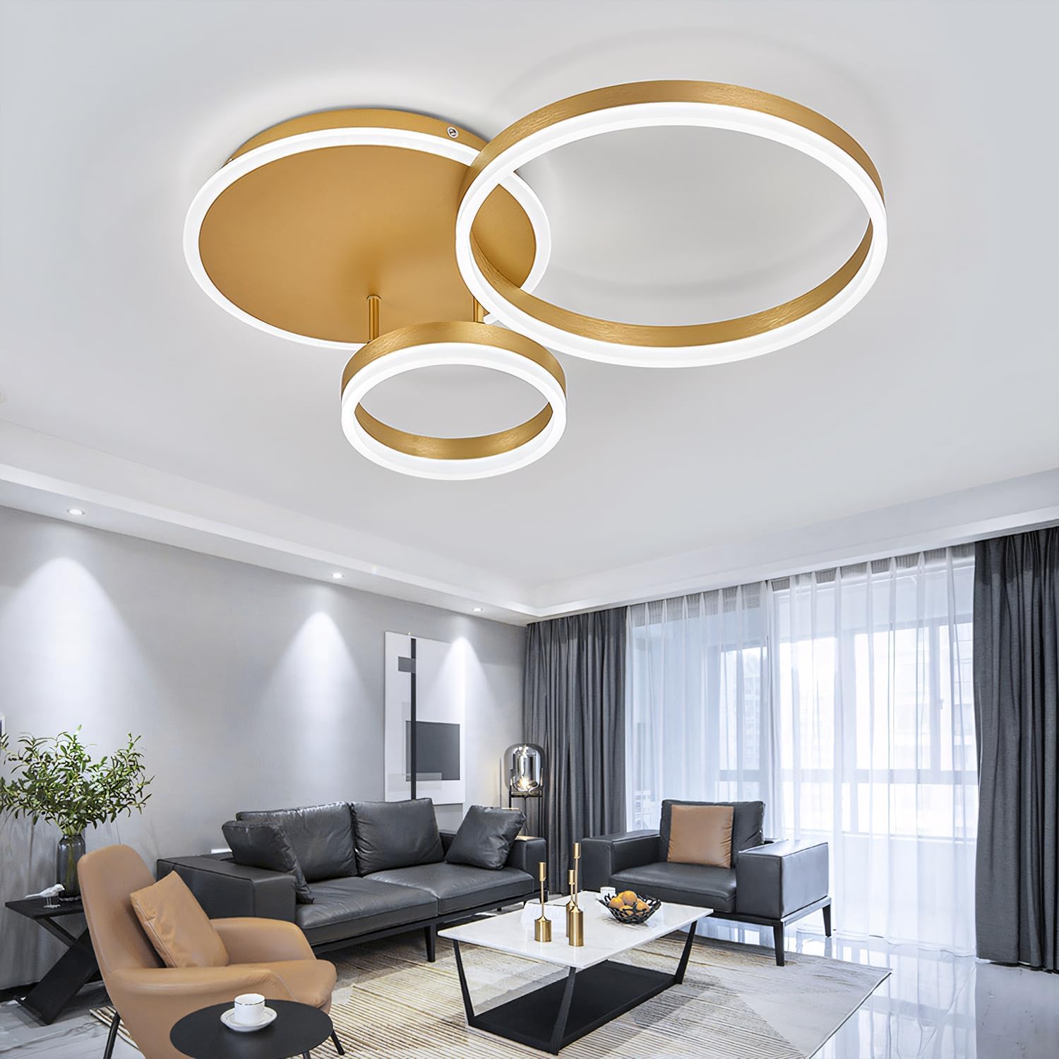 Modern living room with a gold ceiling light fixture