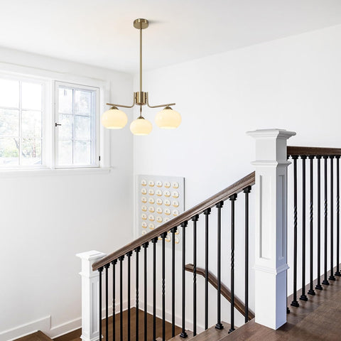 Staircase with a modern chandelier in a well-lit room