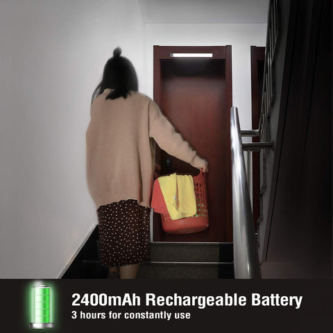 Person with a basket of laundry entering a building with text about a rechargeable battery.