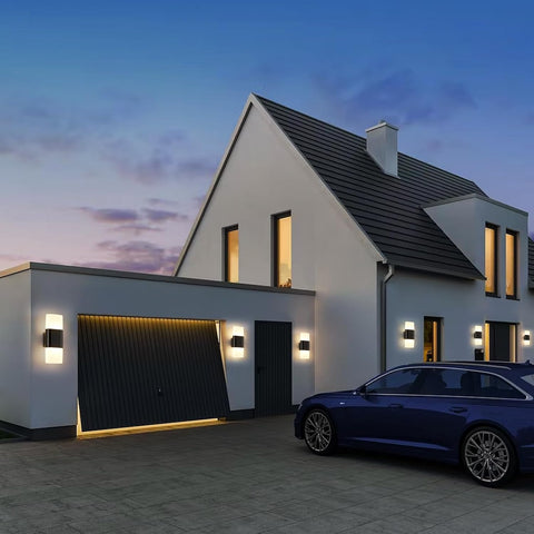 Modern house with a blue car parked in front at dusk