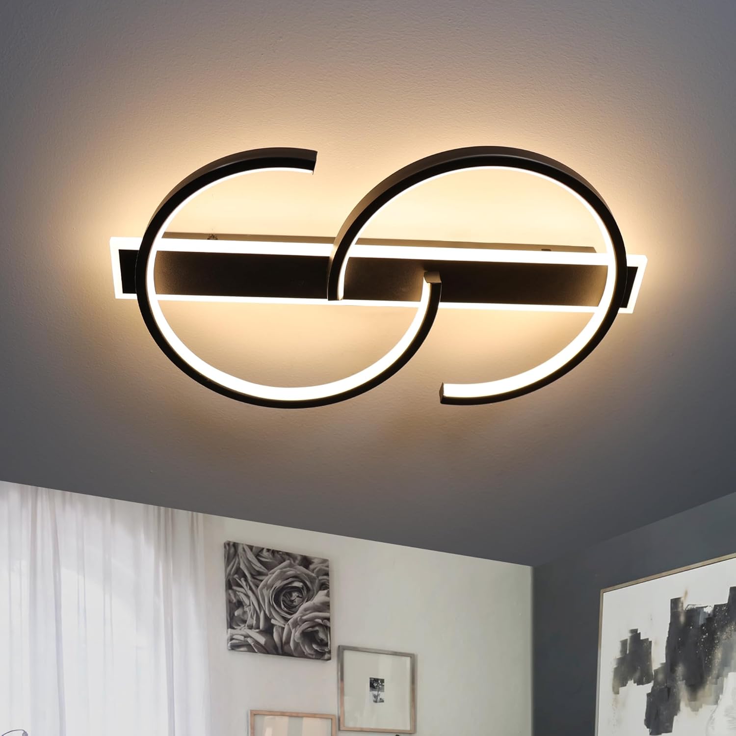 Modern ceiling light fixture with circular design in a room setting