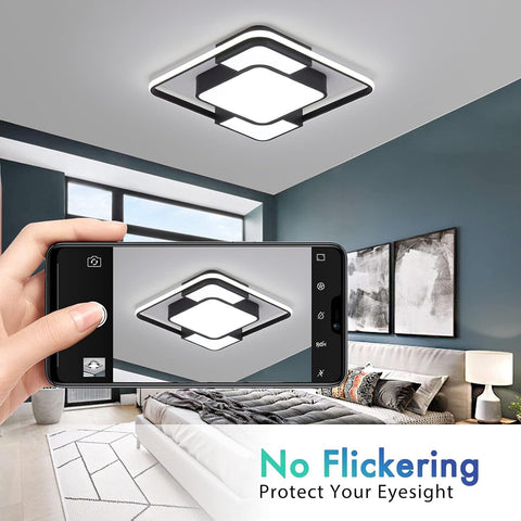 Modern ceiling light fixture in a room with a smartphone showing a close-up of the light.