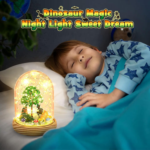 Child sleeping with a dinosaur-themed night light on a bed