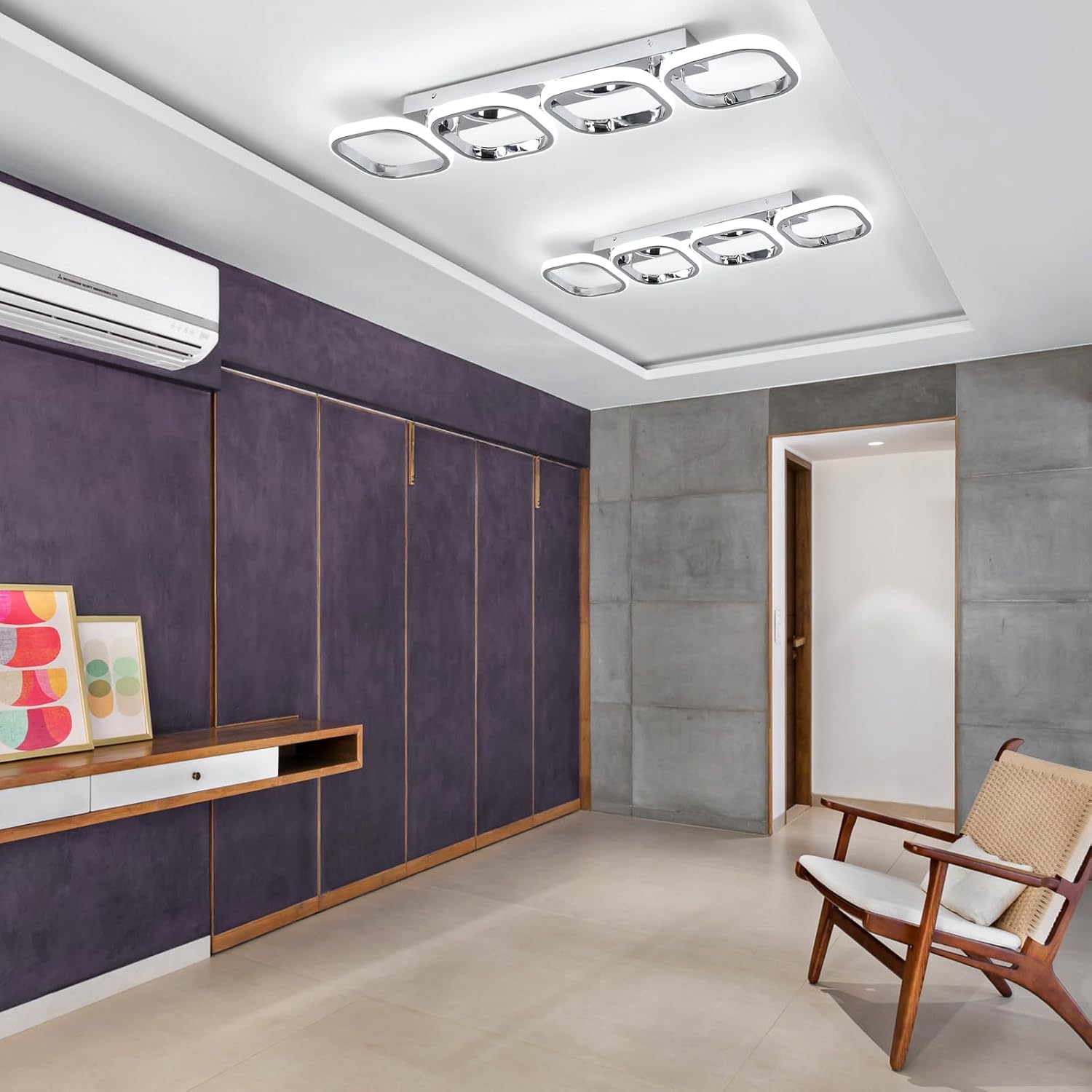 Modern interior room with purple walls, wooden furniture, and a chair.