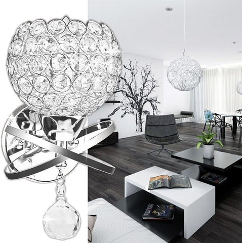 Heart-shaped crystal wall light fixture in a modern living room setting.