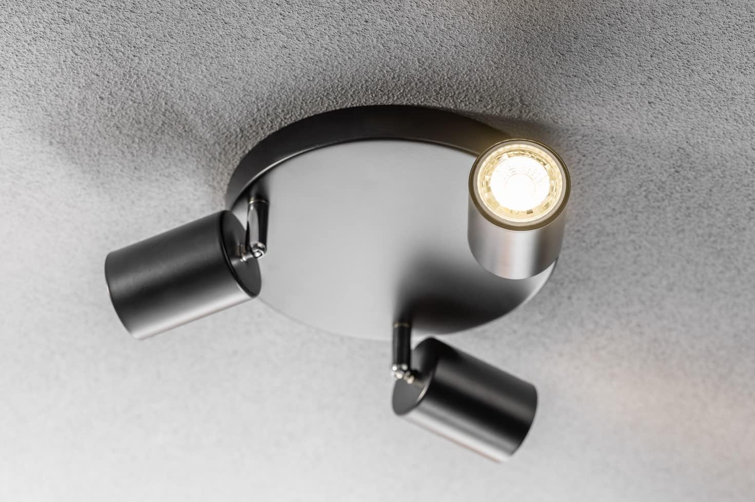 Modern ceiling light fixture on a neutral background