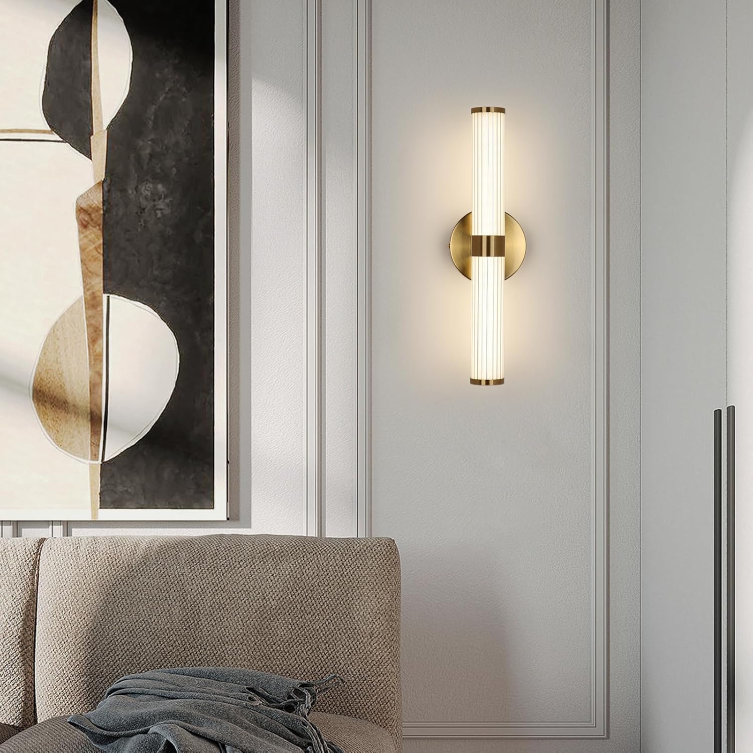 Wall-mounted lamp on a gray wall with abstract art in the background