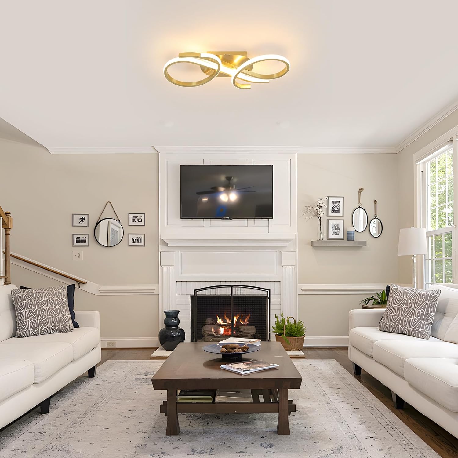 Living room with white sofas, a wooden coffee table, and a fireplace.