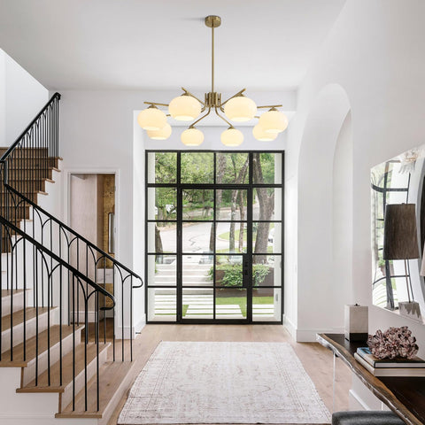 Modern interior with staircase, chandelier, and large window