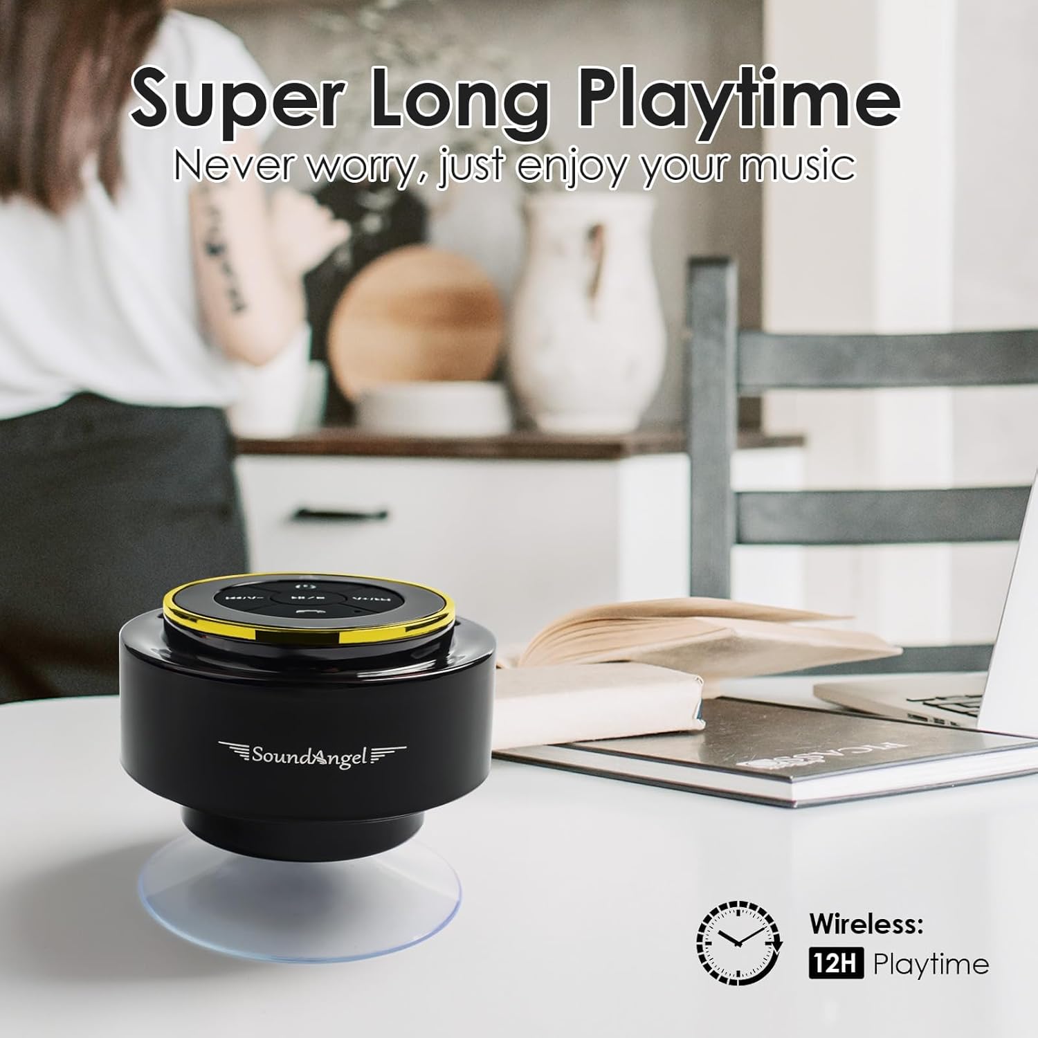 Black and yellow SoundAngel speaker on a table with a blurred background