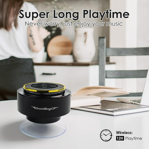 Black and yellow SoundAngel speaker on a table with a blurred background