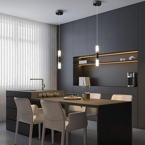 Modern kitchen with dark gray cabinets, a dining table, and chairs.