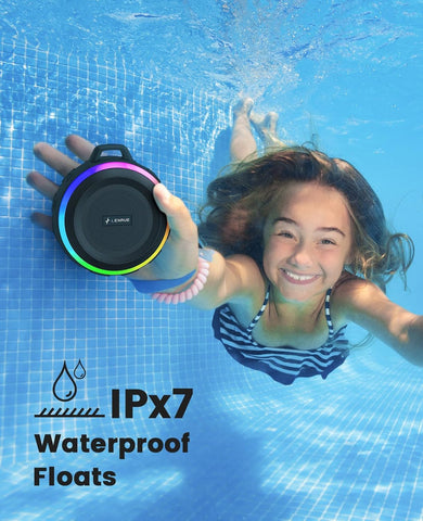 Child holding a waterproof device underwater with 'IPx7 Waterproof Floats' text.