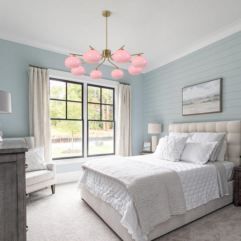 Modern bedroom with pink chandelier, large windows, and light blue walls.