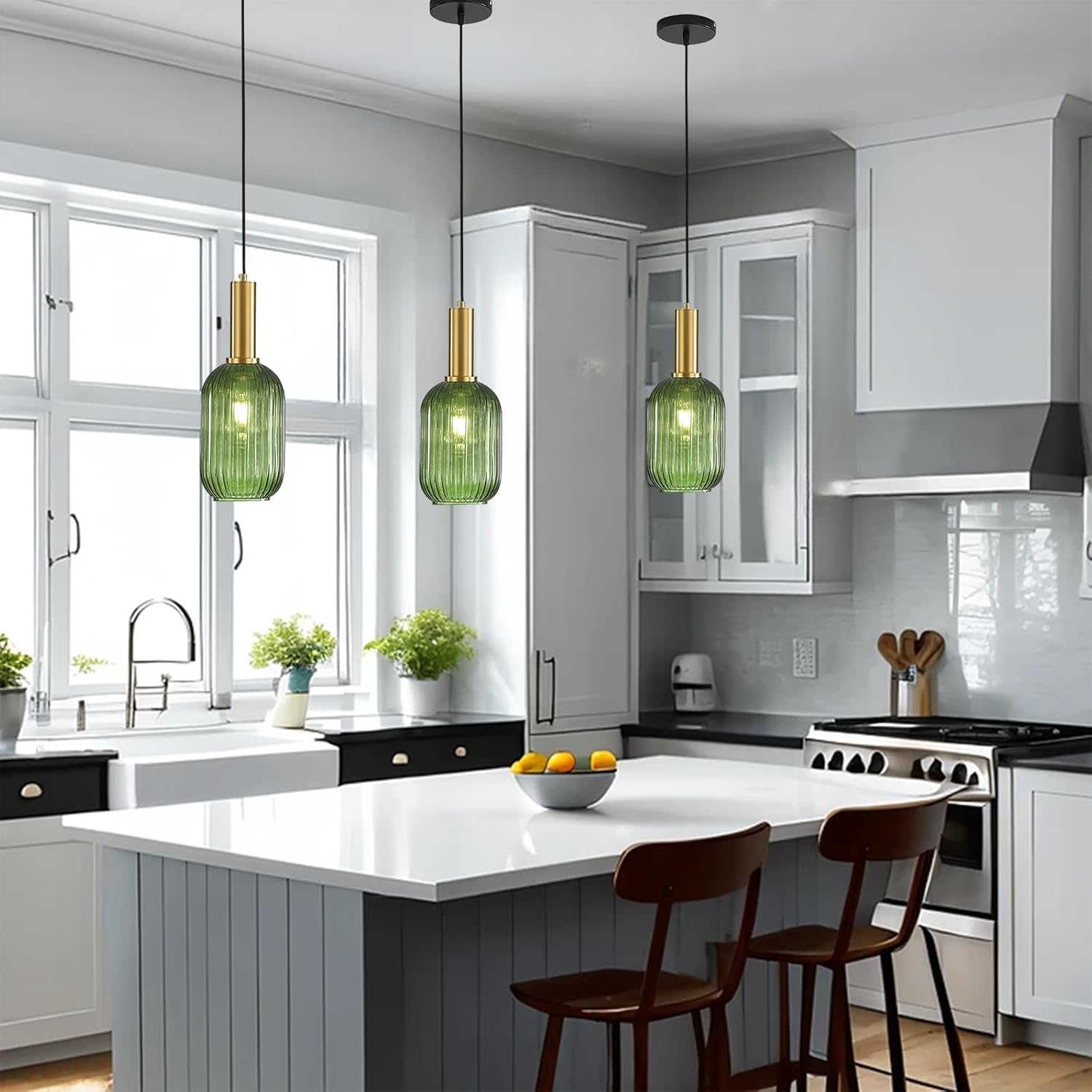 Modern kitchen with white cabinets, green pendant lights, and a kitchen island.
