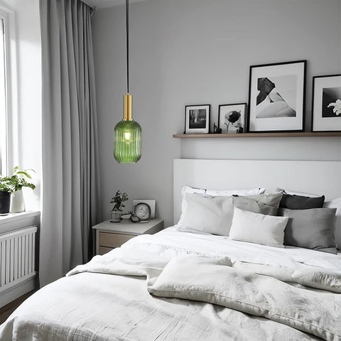 Modern bedroom with a bed, nightstand, and wall art.