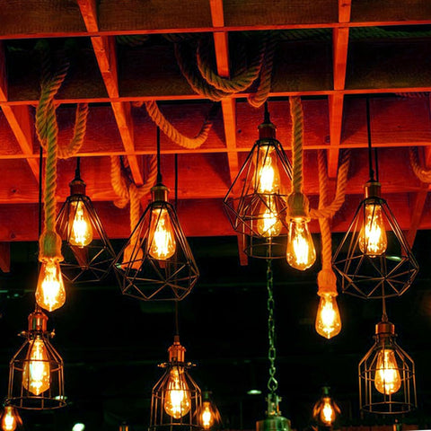 Vintage-style light bulbs hanging from a wooden ceiling