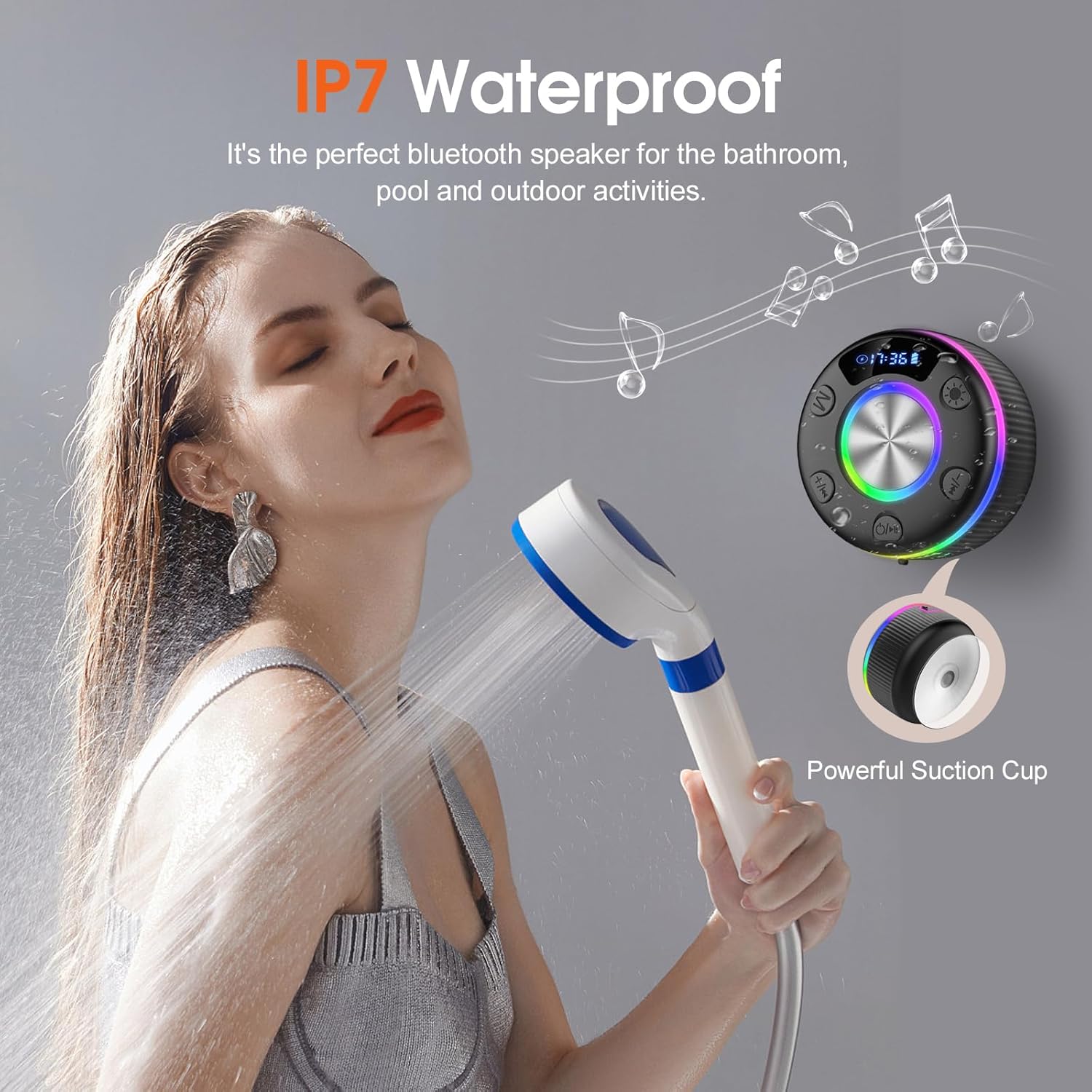 Woman using a shower head with a waterproof Bluetooth speaker and suction cup on a gray background.
