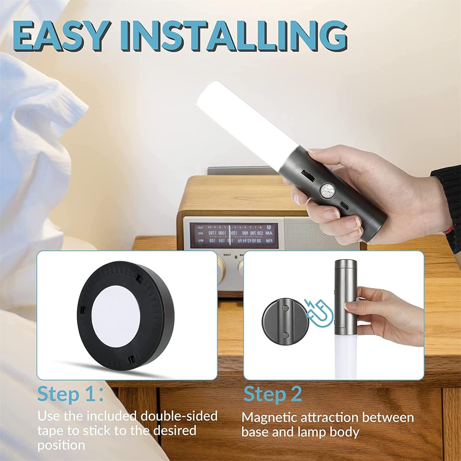 Hand holding a lamp with installation steps displayed on a wooden surface.