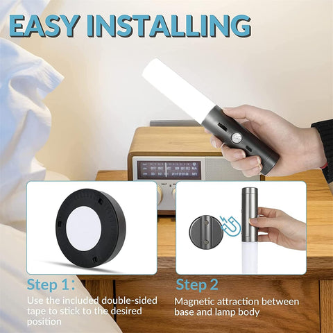 Hand holding a lamp with installation steps displayed on a wooden surface.