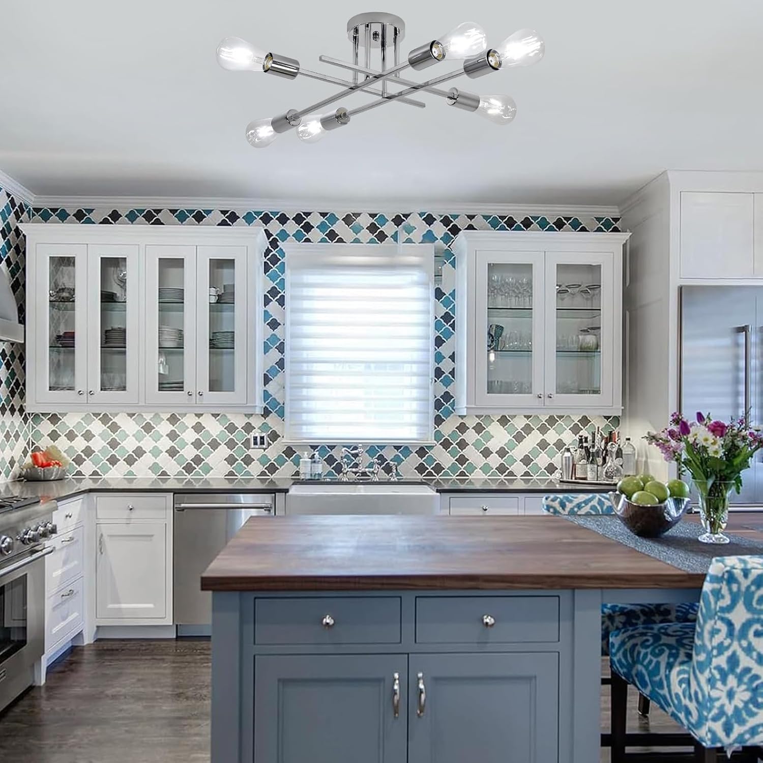 Modern kitchen with blue island, white cabinets, and decorative tiles.