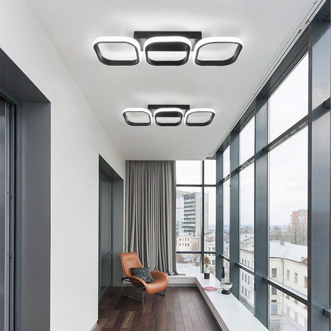 Modern interior design with ceiling lights and large windows