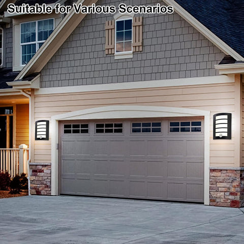 Garage door on a house with decorative lights on a clear day