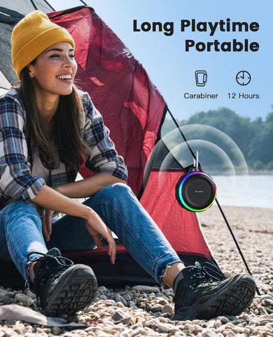 Woman sitting by a tent with a portable device and text about long playtime and portable design.