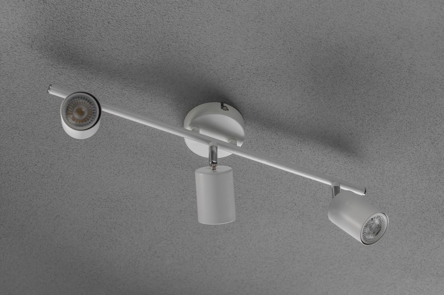 Modern ceiling light fixture on a gray background