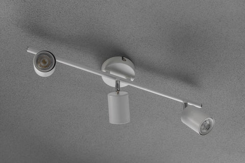 Modern ceiling light fixture on a gray background