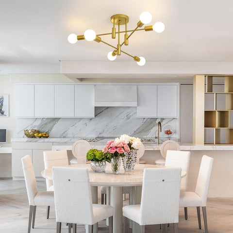 Modern kitchen with a dining table, chairs, and decorative elements.