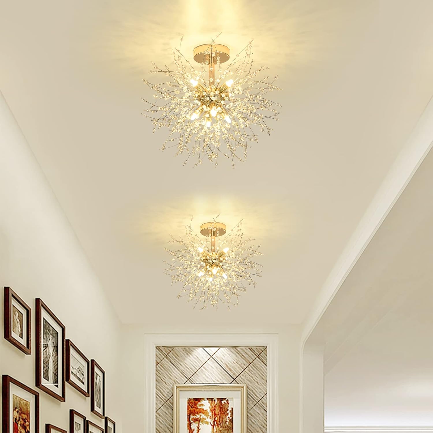 Two decorative ceiling lights in a hallway with framed pictures on the wall.