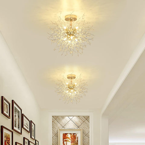 Two decorative ceiling lights in a hallway with framed pictures on the wall.