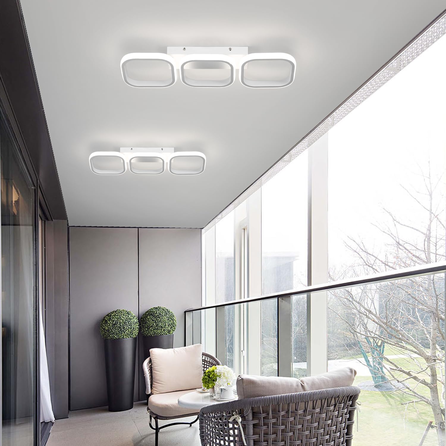 Modern indoor setting with ceiling lights and a view of trees outside.