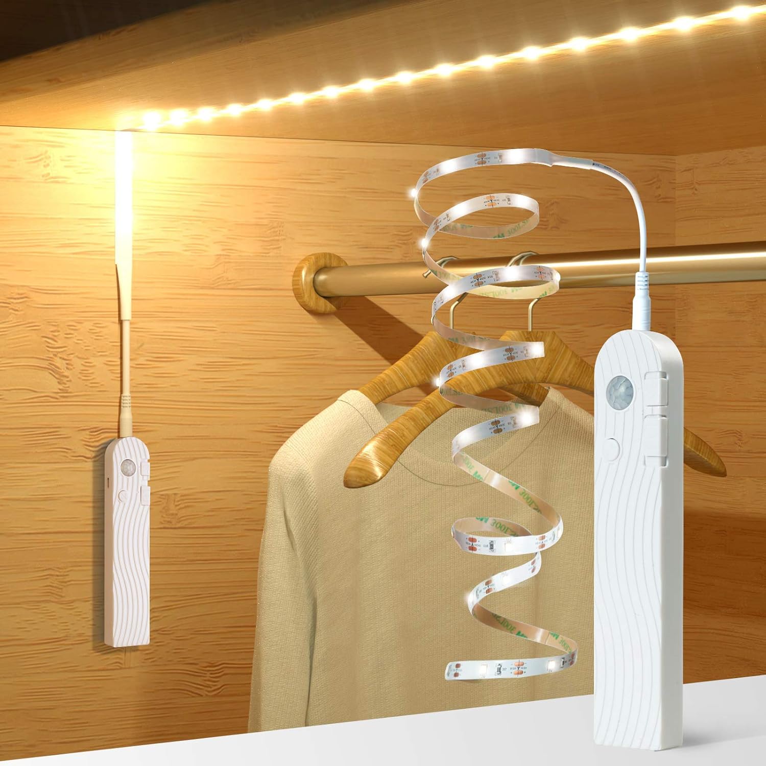 Clothing hanger with LED strip light and remote control on a wooden background