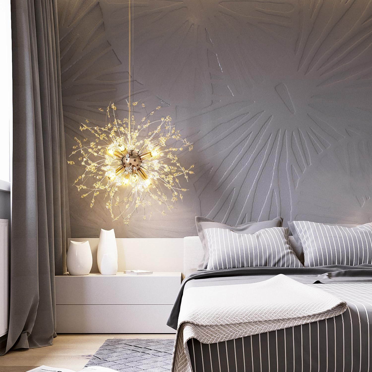 Modern bedroom with decorative wall, chandelier, and bed.