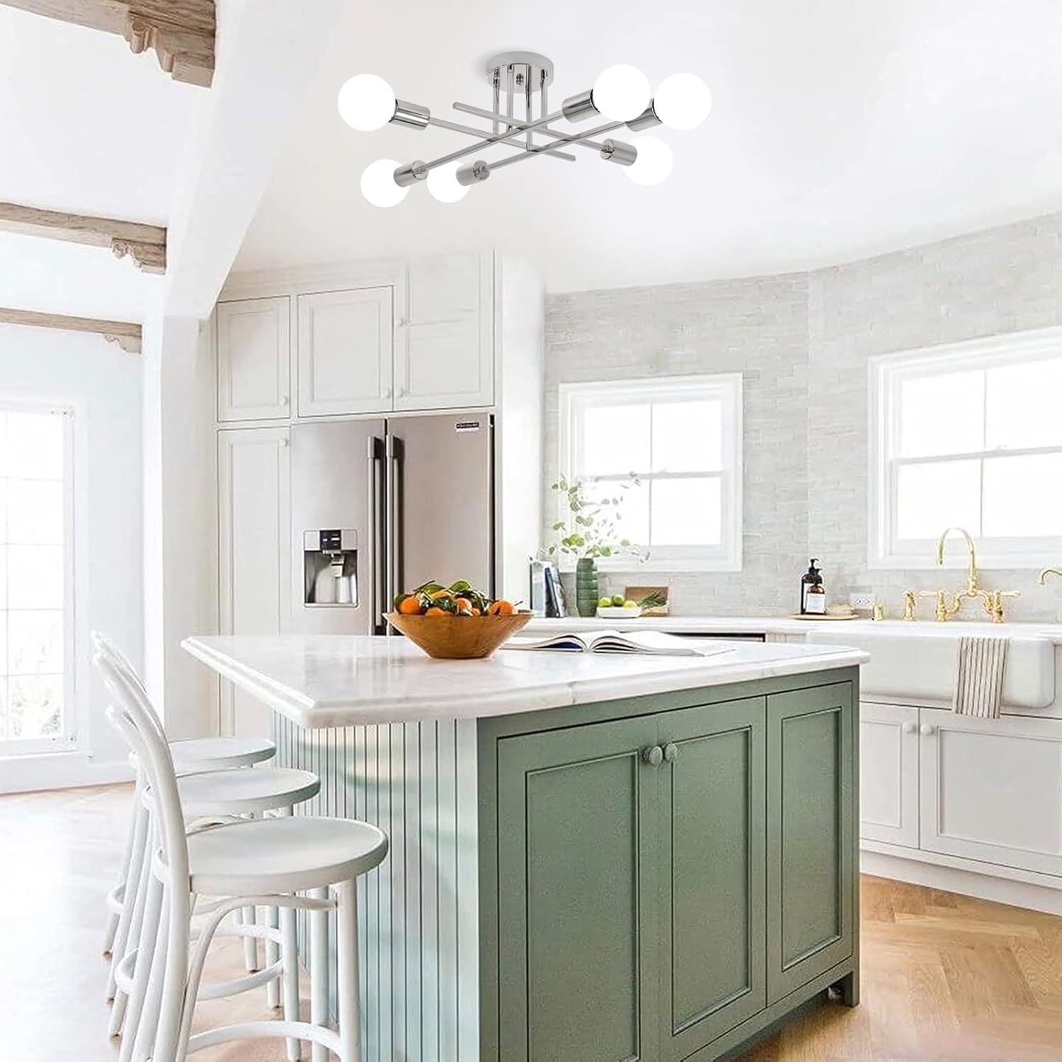 Modern kitchen with a green island, white cabinets, and stainless steel appliances.