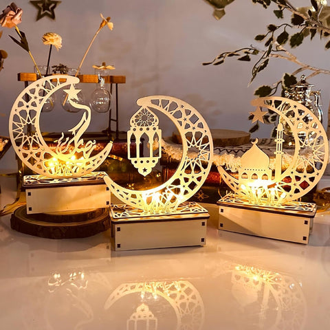Decorative lamps shaped like moons and a mosque on a reflective surface.