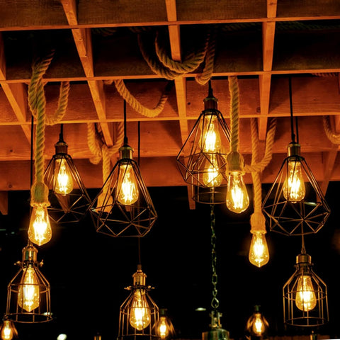 Vintage-style light bulbs hanging from a wooden ceiling