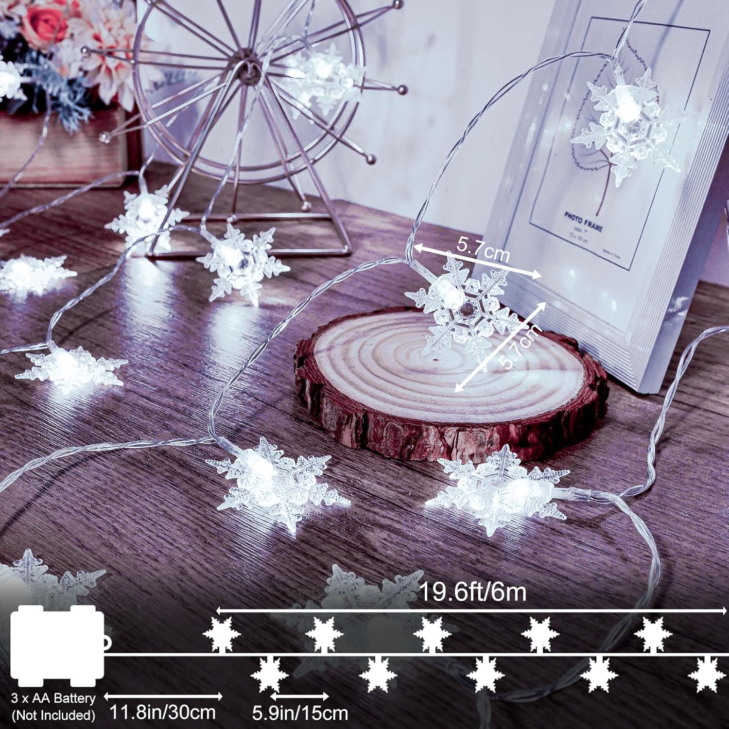 String lights shaped like snowflakes on a wooden surface with measurements displayed.