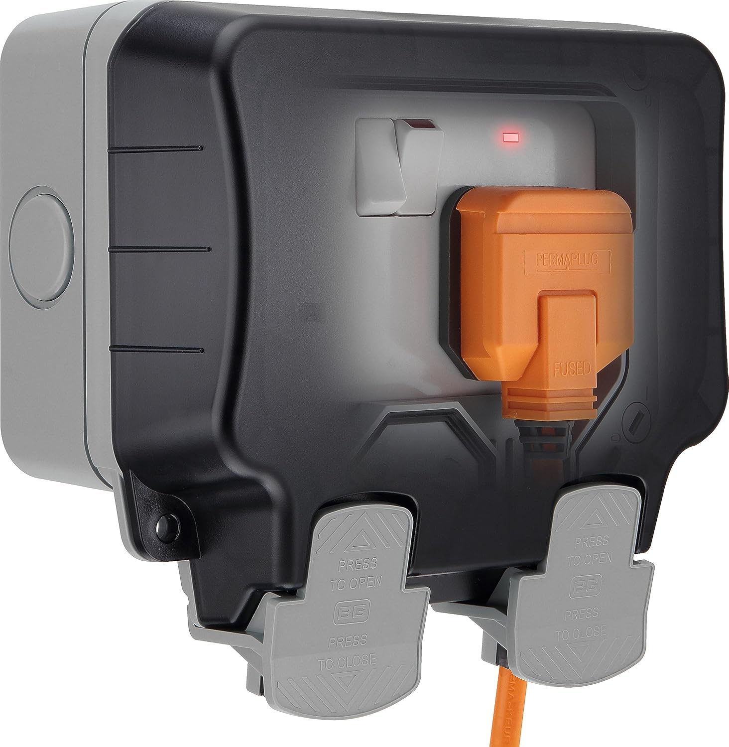 Black electrical outlet with orange plug on a white background