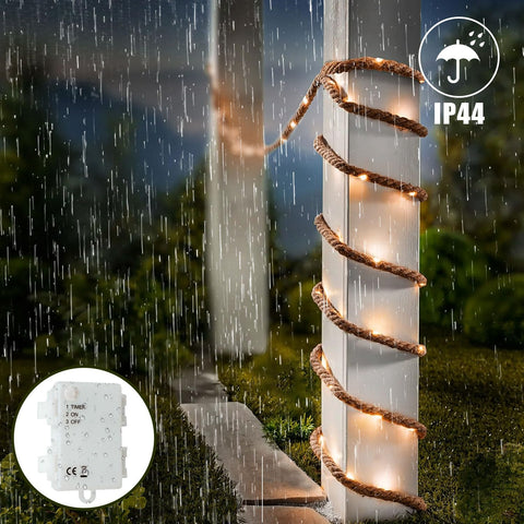 Decorative outdoor light post with rope detailing in a rain-soaked garden, featuring IP44 rating.