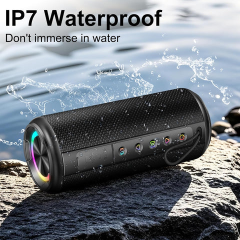 Waterproof Bluetooth speaker on a rock with water splashes, indicating its IP7 rating.