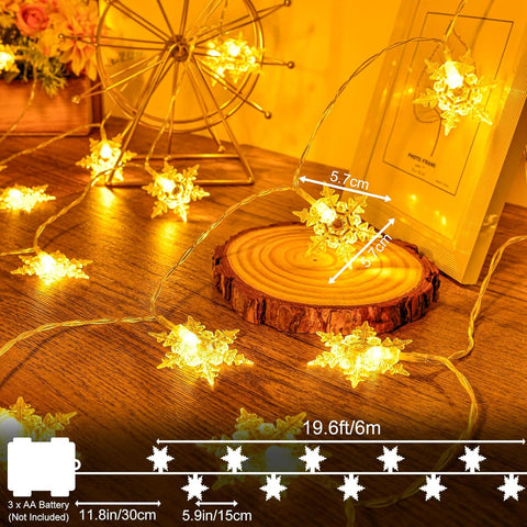 String lights with measurements on a wooden surface