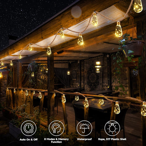 String lights hanging from a wooden roof at night, creating a warm and inviting atmosphere.